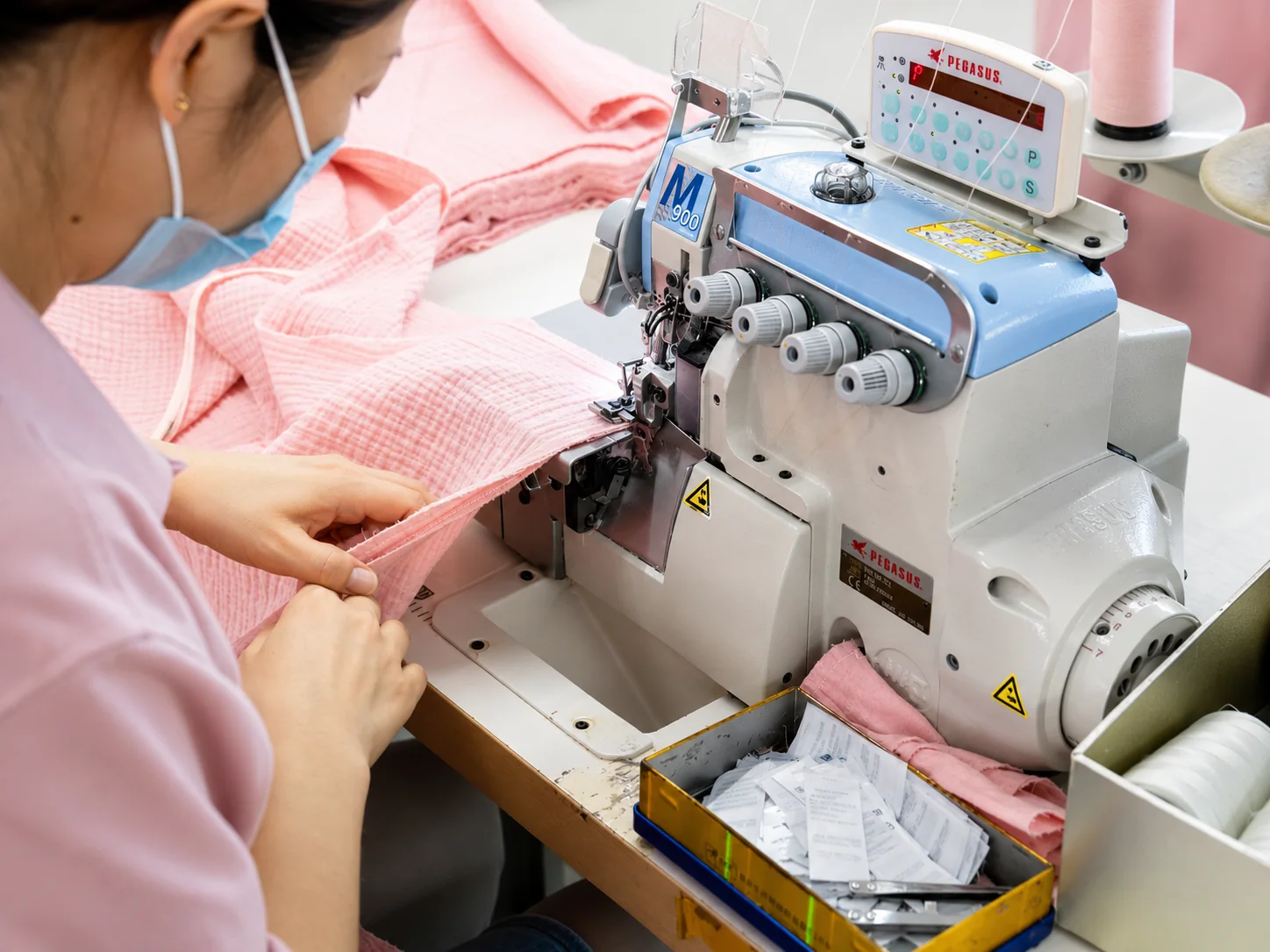 Overlock sewing on pink fabric